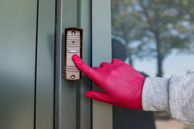 Landlord ringing doorbell of a tenant